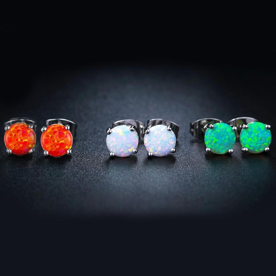 Three pairs of opal stud earrings designed in Italy, featuring 18K white gold plating and embellished with Austrian crystals.