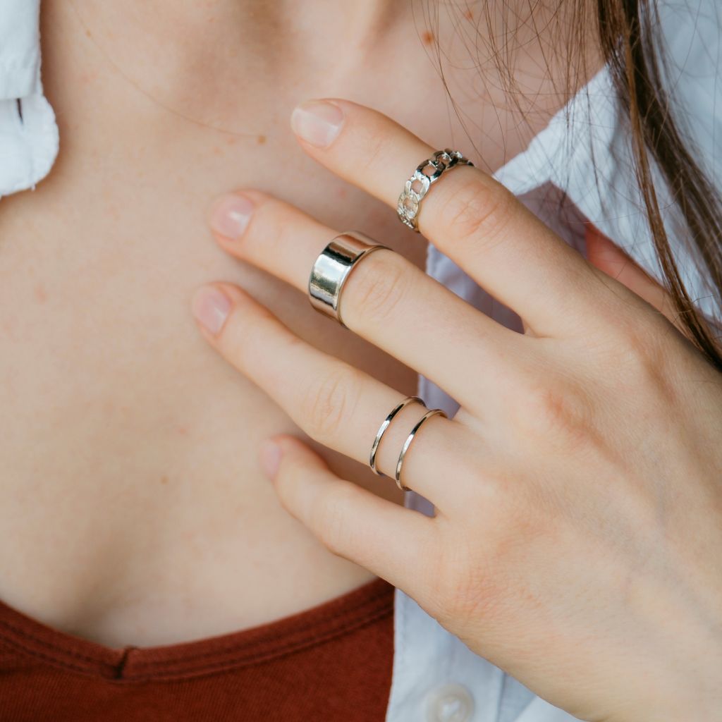 A stylish 3 Piece Adjustable Wide Band Silver Cuff Resizable Boho Ring Set displayed elegantly, showcasing unique designs and a classic silver finish.