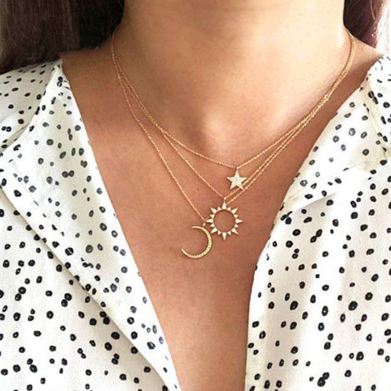 A stunning 3 Piece Celestial Pave Necklace featuring ® Crystals, elegantly designed with 18K gold plating and a link chain.