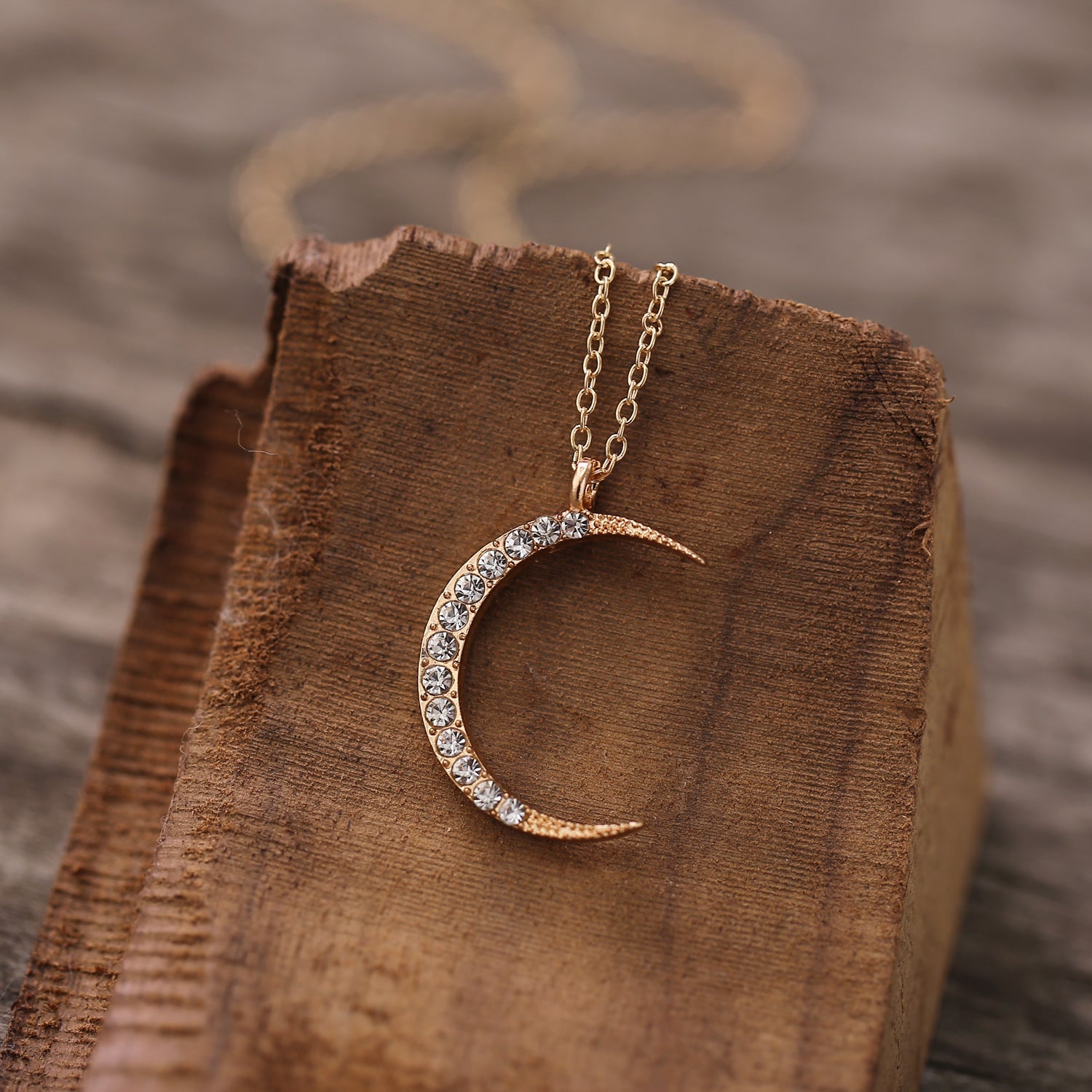 A stunning 3 Piece Celestial Pave Necklace featuring ® Crystals, elegantly designed with 18K gold plating and a link chain.