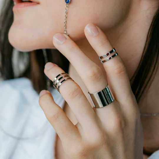 Three-piece silver adjustable thick wide band cuff ring set displayed elegantly, showcasing their boho-chic design and adjustable features.