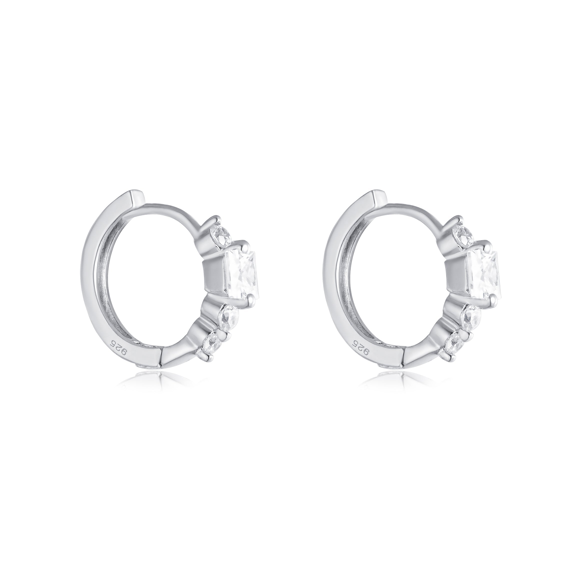 Elegant 3 stones minimalist huggie hoop earrings made of 925 sterling silver with white sapphires, showcasing a modern design.