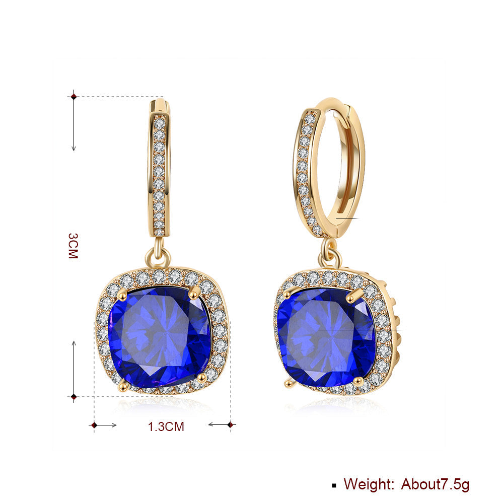 Elegant 3.00 Ct Sapphire Asscher Cut Halo Drop Earrings in 18K Gold Plated, showcasing their stunning design and vibrant sapphires.