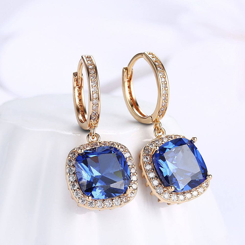 Elegant 3.00 Ct Sapphire Asscher Cut Halo Drop Earrings in 18K Gold Plated, showcasing their stunning design and vibrant sapphires.