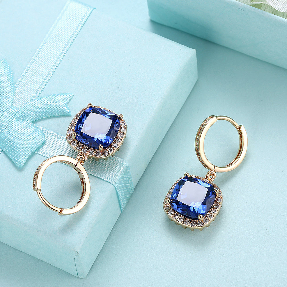 Elegant 3.00 Ct Sapphire Asscher Cut Halo Drop Earrings in 18K Gold Plated, showcasing their stunning design and vibrant sapphires.