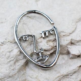 A stylish 316L stainless steel cartilage earring featuring an abstract face design, showcasing its unique artistic flair.