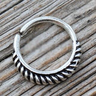 A 316L stainless steel seamless ring featuring a unique braiding design with partial black plating, ideal for septum and cartilage piercings.