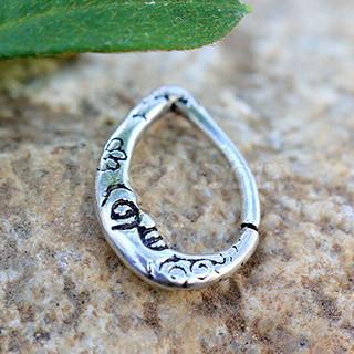 A detailed view of a 316L stainless steel crescent moon teardrop seamless ring with an antique silver plated finish.