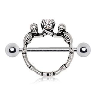 A detailed 316L stainless steel nipple shield featuring two skeletons holding a clear cubic zirconia stone, showcasing intricate design and craftsmanship.