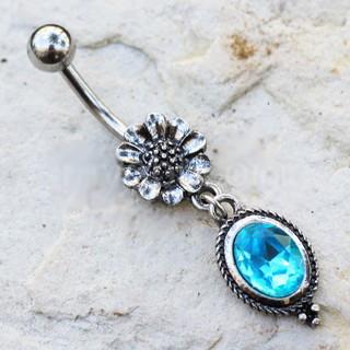 A detailed 316L stainless steel navel ring featuring a flower design and an aqua cubic zirconia pendant, showcasing intricate craftsmanship.