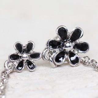 A stylish 316L stainless steel flower chain nose and cartilage earring featuring a black flower design, showcasing its elegant and durable construction.