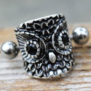 A detailed 316L stainless steel cartilage cuff earring featuring an intricately designed owl with a black cubic zirconia eye.