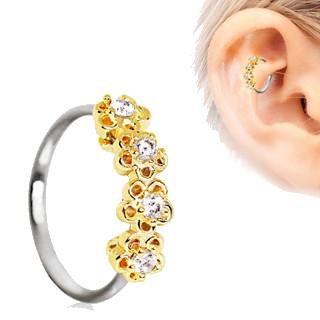 A beautiful 316L stainless steel seamless circular ring featuring golden flowers and clear cubic zirconia, perfect for daith piercings.