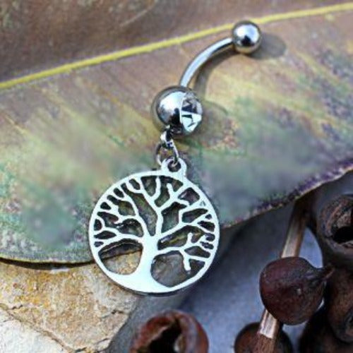 A stylish 316L stainless steel dangle navel ring featuring a Tree of Life design inside a round frame, adorned with a clear cubic zirconia charm.