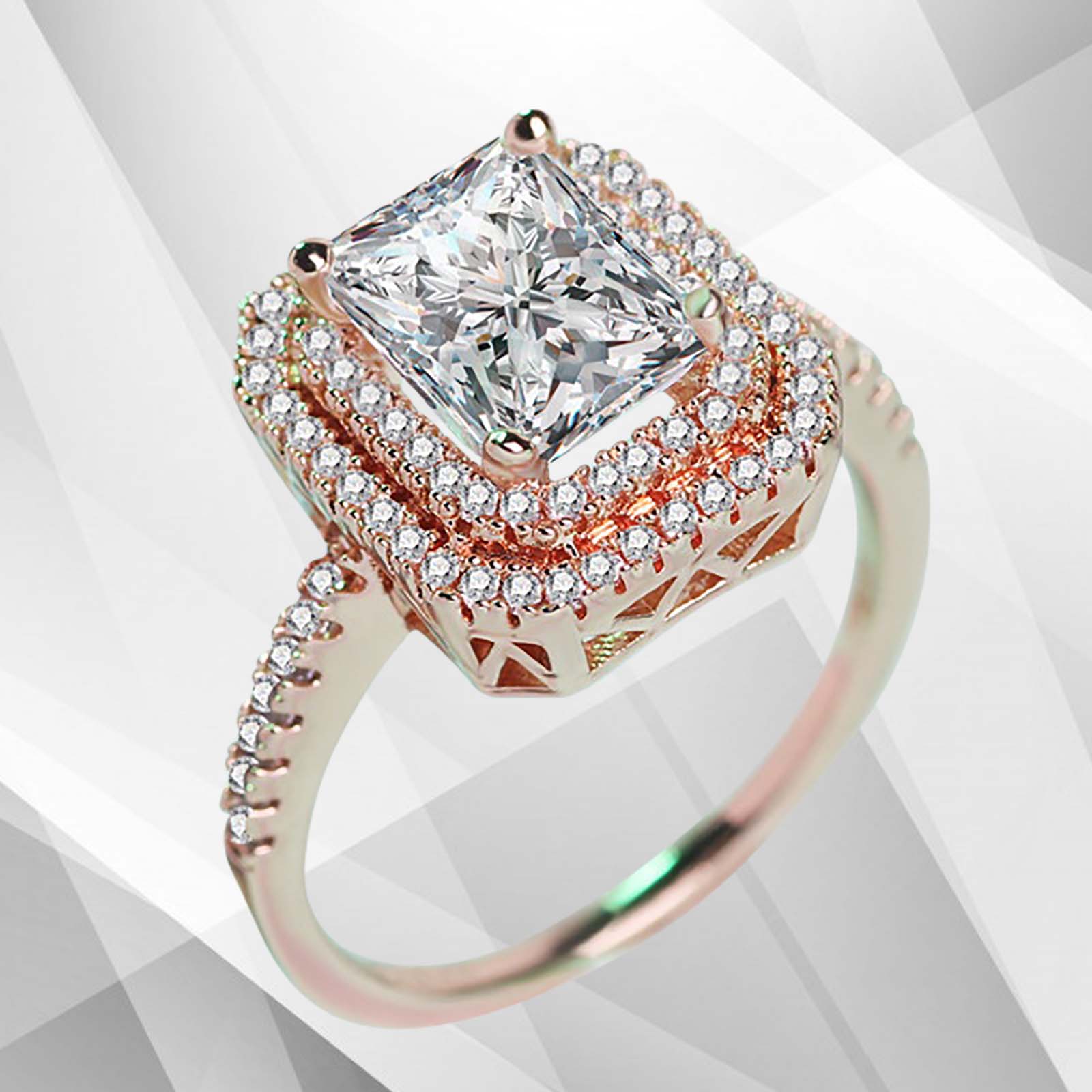 3.2Ct CZ Diamond Cushion Halo Bridal Engagement Ring in 18Ct Rose Gold, featuring a sparkling pave setting and a luxurious design.