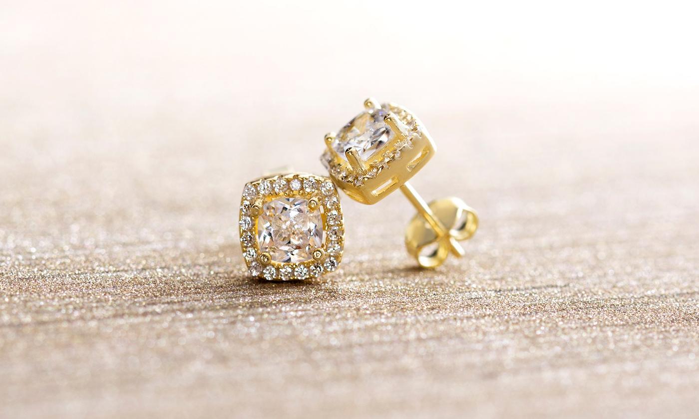 A pair of elegant 3.44 CTTW Halo Stud Earrings featuring Elements crystals, set in brass with 18K white gold plating.