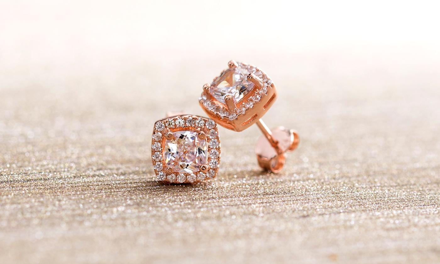 A pair of elegant 3.44 CTTW Halo Stud Earrings featuring Elements crystals, set in brass with 18K white gold plating.