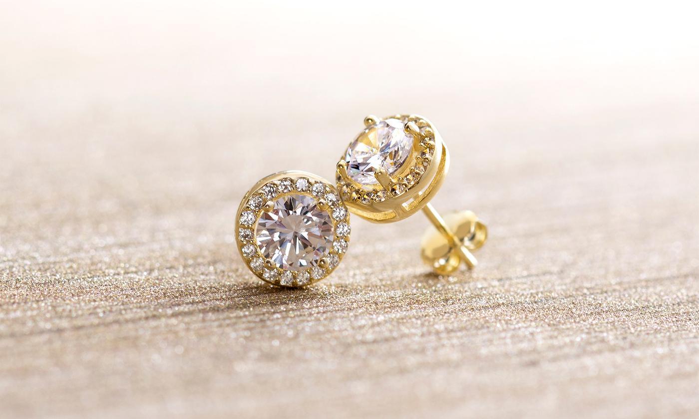 A pair of elegant 3.44 CTTW Halo Stud Earrings featuring Elements crystals, set in brass with 18K white gold plating.