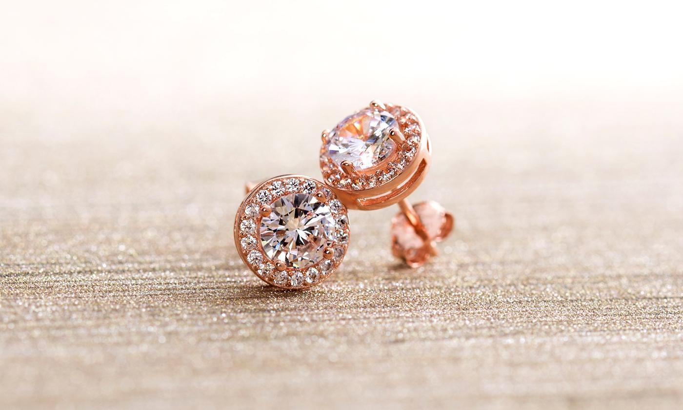 A pair of elegant 3.44 CTTW Halo Stud Earrings featuring Elements crystals, set in brass with 18K white gold plating.