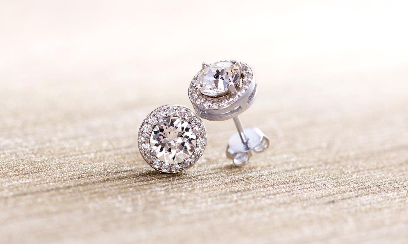 A pair of elegant 3.44 CTTW Halo Stud Earrings featuring Elements crystals, set in brass with 18K white gold plating.