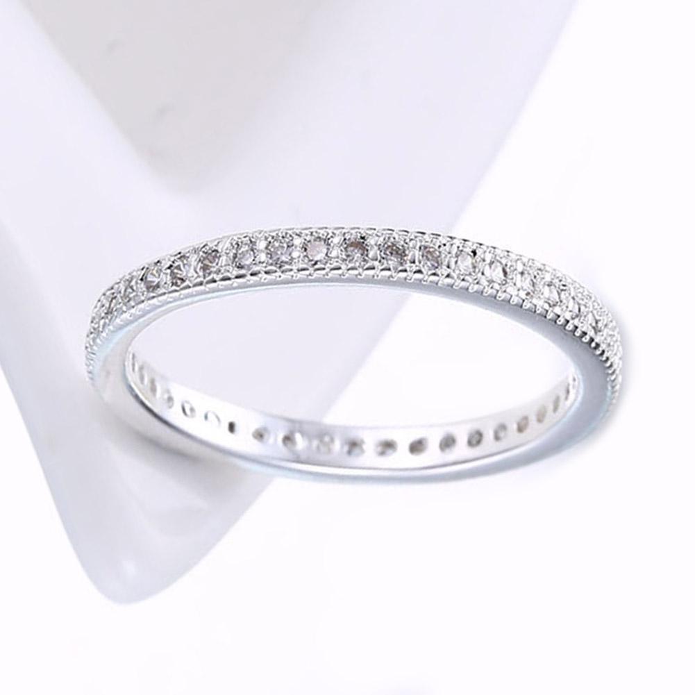 3mm Crystal Band Ring featuring quality round diamonds on an 18K white gold band, available in two colors.