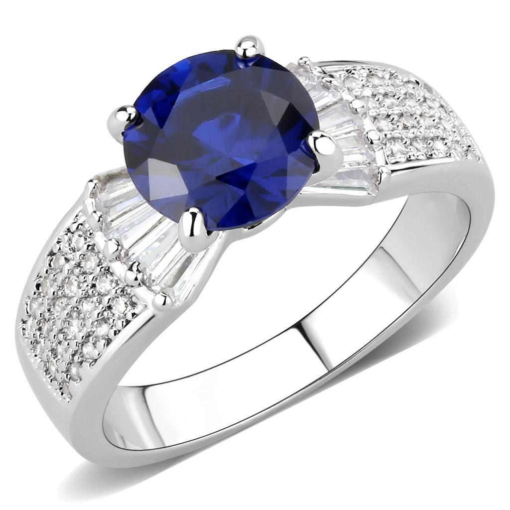 3W1562 Rhodium Brass Ring featuring a vibrant London Blue Synthetic Spinel, elegantly designed with a shiny finish.