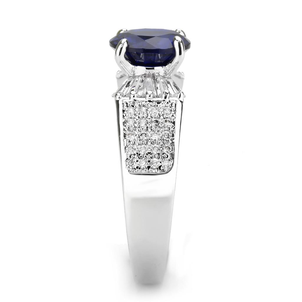 3W1562 Rhodium Brass Ring featuring a vibrant London Blue Synthetic Spinel, elegantly designed with a shiny finish.