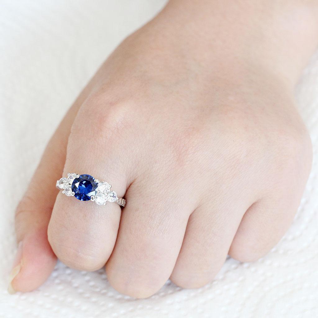 3W1601 Rhodium Brass Ring featuring an 8 mm AAA Grade CZ stone in London Blue, showcasing its elegant design and luxurious finish.