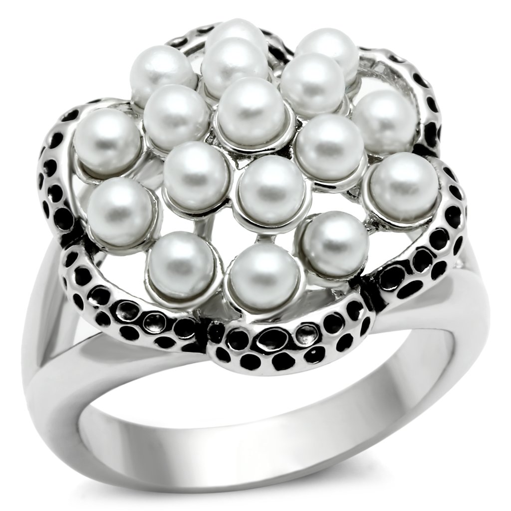 Rhodium brass ring featuring a synthetic white pearl centerpiece, elegantly designed for any occasion.