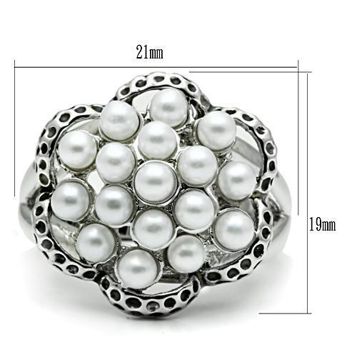 Rhodium brass ring featuring a synthetic white pearl centerpiece, elegantly designed for any occasion.