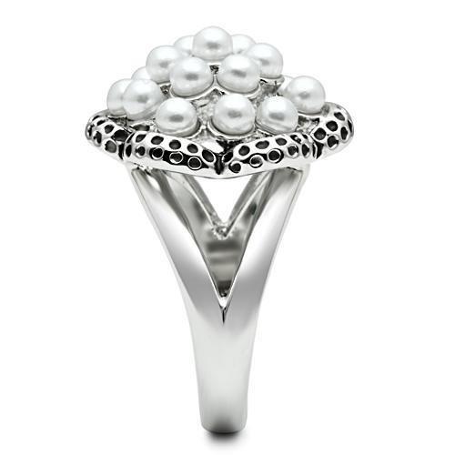 Rhodium brass ring featuring a synthetic white pearl centerpiece, elegantly designed for any occasion.