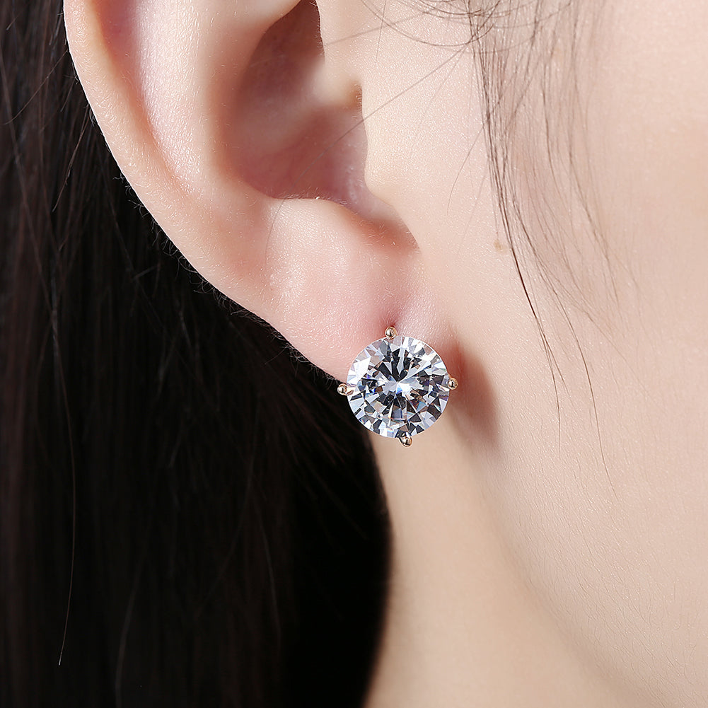 Elegant 4 Prong Stone Huggie Earring in 18K Gold Plated, showcasing its luxurious design and hypoallergenic features.