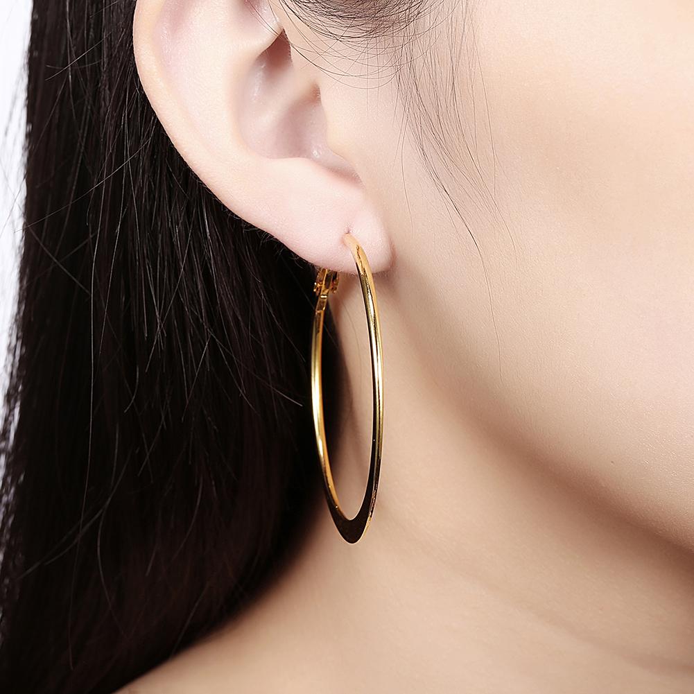 A pair of elegant 42mm flat hoop earrings in 18K gold plating, showcasing a sleek and modern design.