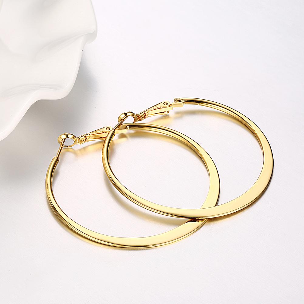 A pair of elegant 42mm flat hoop earrings in 18K gold plating, showcasing a sleek and modern design.