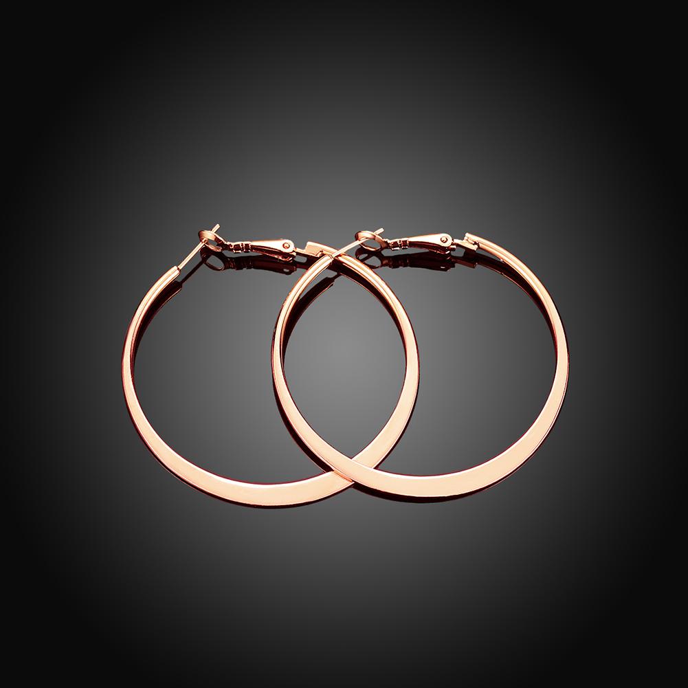 A pair of elegant 42mm flat hoop earrings in 18K rose gold plating, showcasing their shiny finish and comfortable design.