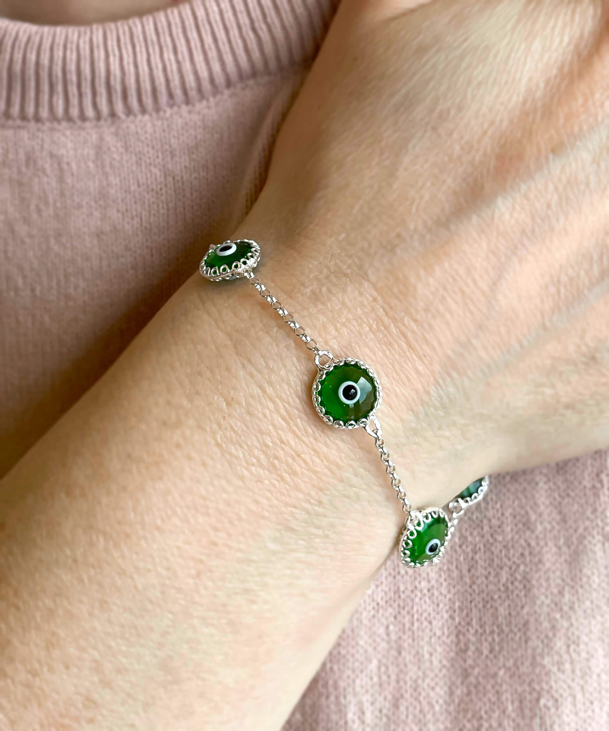 Mint green evil eye women silver link bracelet featuring five beads and a strong rolo chain, elegantly designed for protection and style.