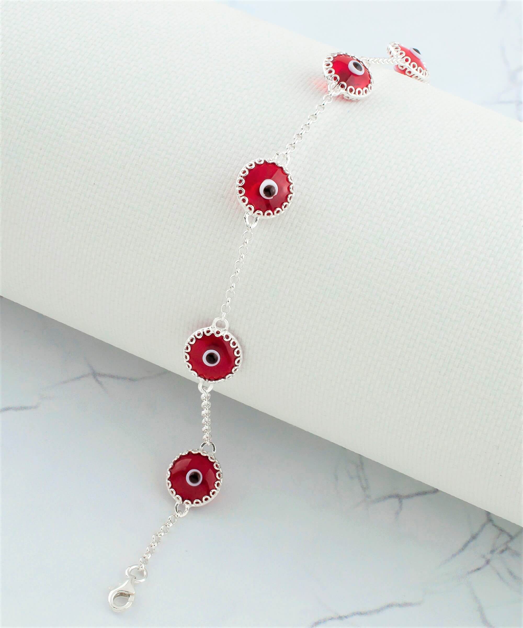 A stylish 5 Beads Red Evil Eye Women Silver Link Bracelet featuring five red evil eye beads wrapped in silver prongs on a rolo chain.