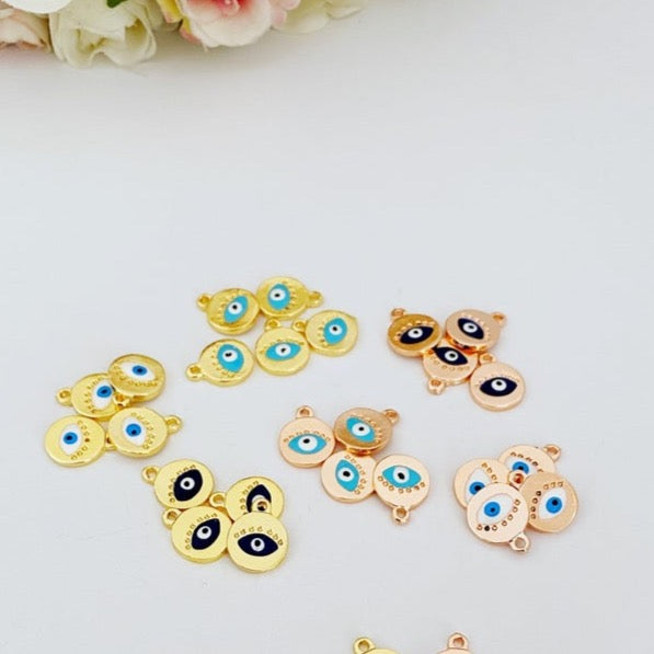 Five rose gold evil eye charms with customizable eye colors, perfect for jewelry making.