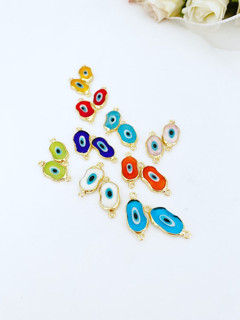 Five handmade green Murano glass evil eye beads with gold accents, ideal for jewelry making.