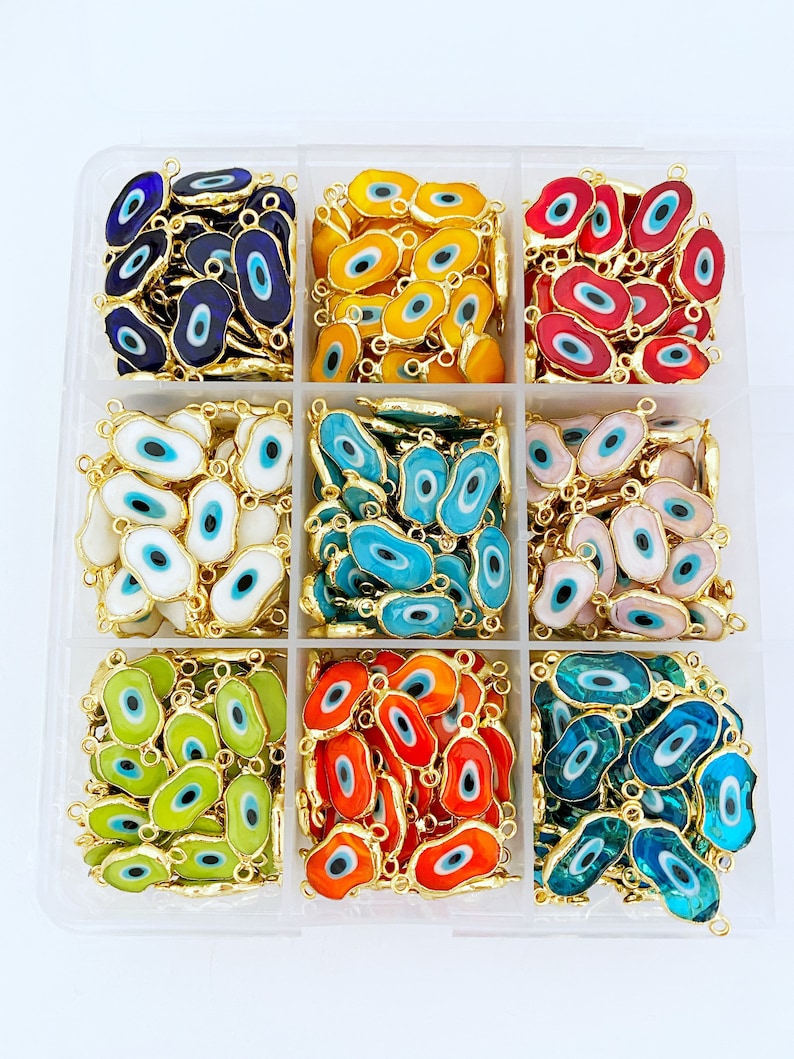 Five handmade Murano glass beads featuring Evil Eye designs in various colors, showcasing their intricate details and 22K gold plating.