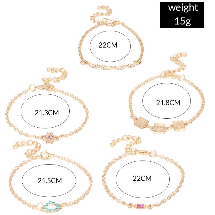 A stylish 5 piece bracelet set featuring cute and kitschy designs with colored crystals, elegantly plated in 14K gold.