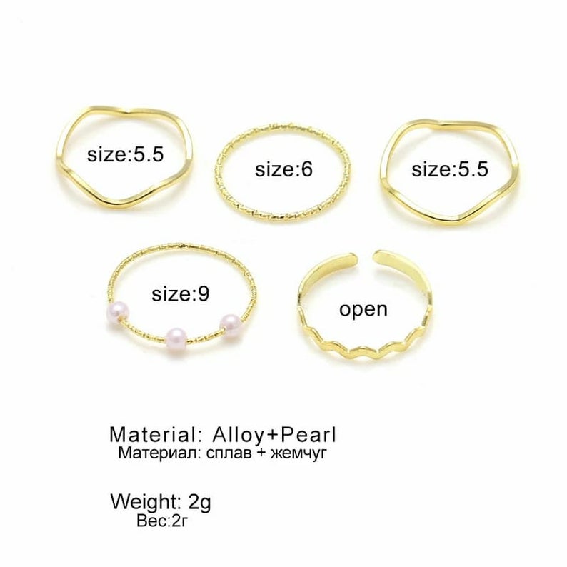 5 Piece Slim Silver Gold Stackable Midi Pearl Ring Set displayed elegantly, showcasing the rings' minimalist design and bohemian style.