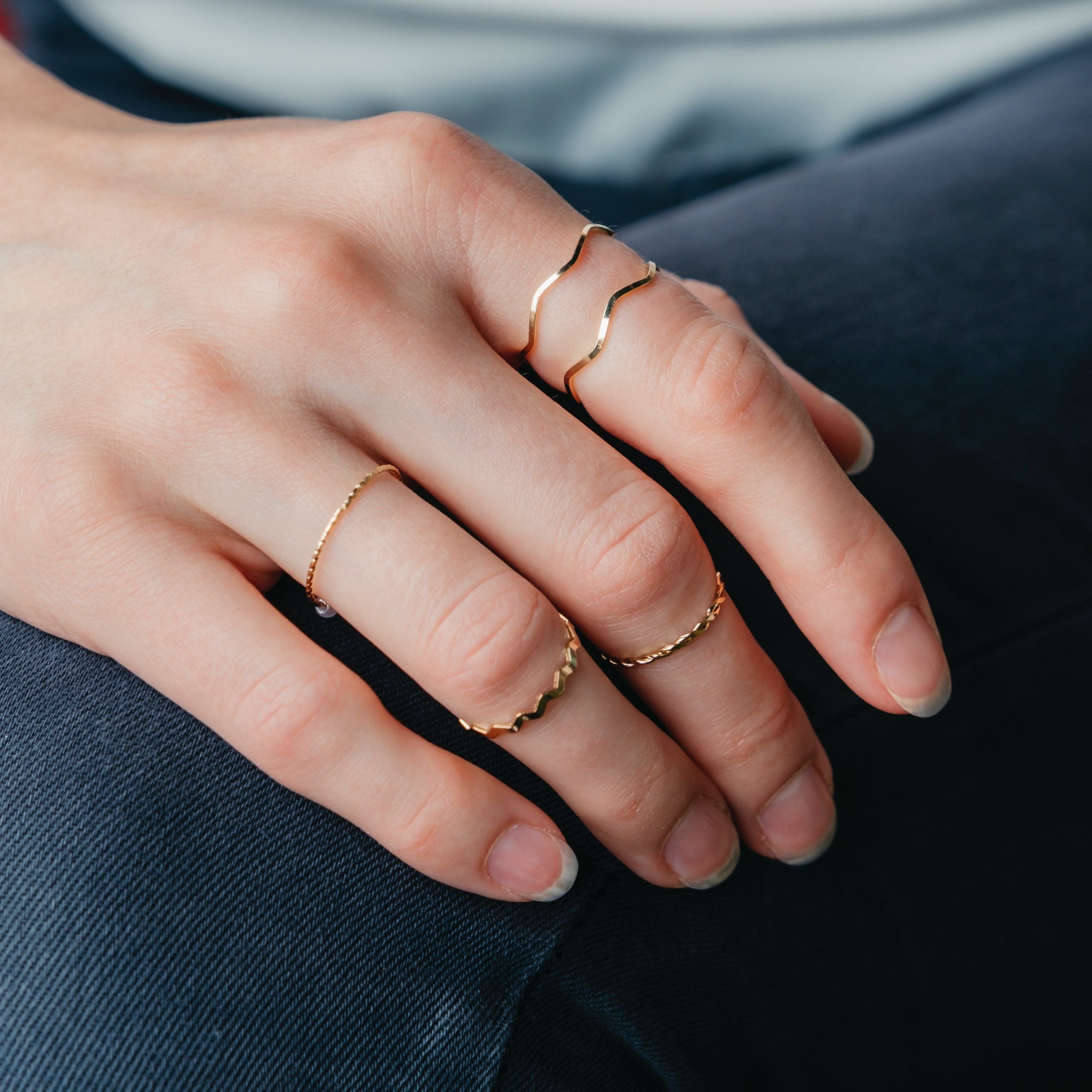 5 Piece Slim Silver Gold Stackable Midi Pearl Ring Set displayed elegantly, showcasing the rings' minimalist design and bohemian style.