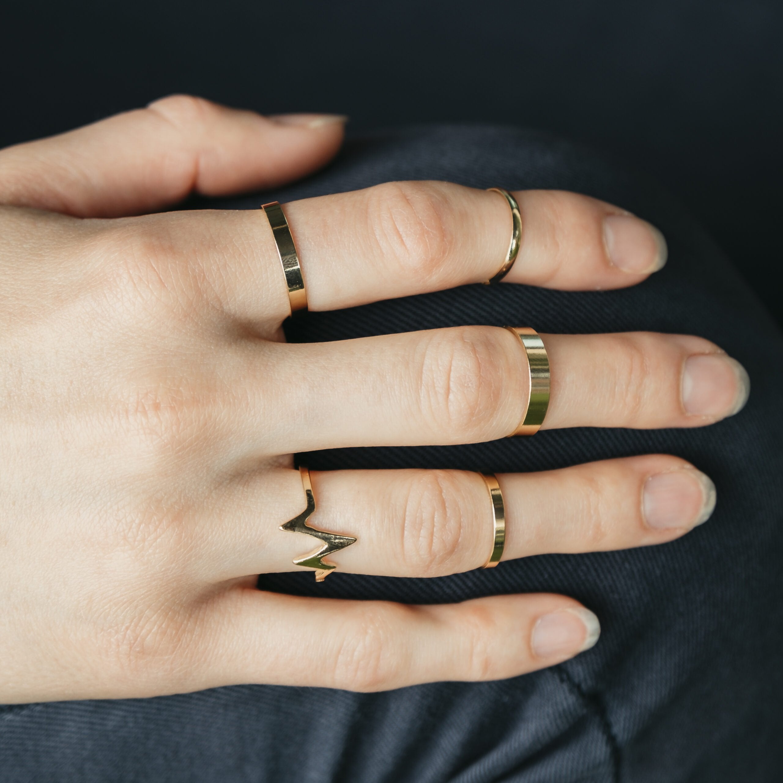 5 Piece Stackable Midi Gold Silver Chevron Knuckle Boho Ring Set displayed elegantly, showcasing the intricate design and color options.