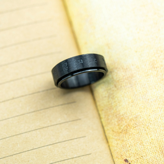 6mm Matt Black Buddhist Tibetan Spinner Prayer Ring, showcasing a sleek design with a rotating feature, crafted from stainless steel.