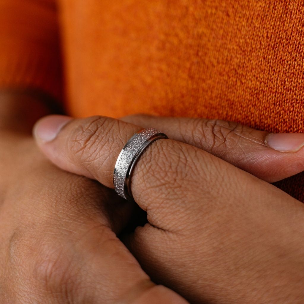 6mm Mens Black Rotatable Spinner Stainless Steel Promise Ring showcasing its sleek black finish and minimalist design.