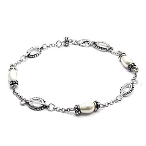 A beautiful rhodium brass bracelet featuring a synthetic white pearl centerpiece, showcasing elegance and modern design.