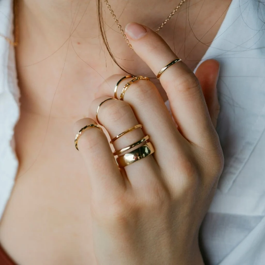 A stylish 7 Piece Multisize Band Silver Cuff Stackable Boho Ring set displayed elegantly, showcasing intricate designs and assorted sizes.