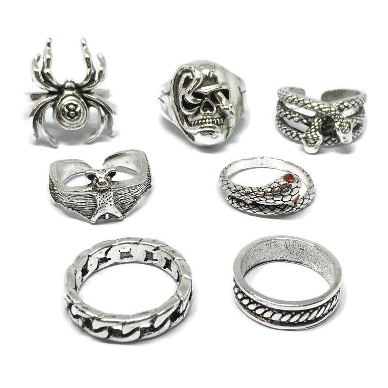 A stylish 7 Piece Spider Ring Set made of sterling silver plated steel alloy, featuring intricate spider designs.