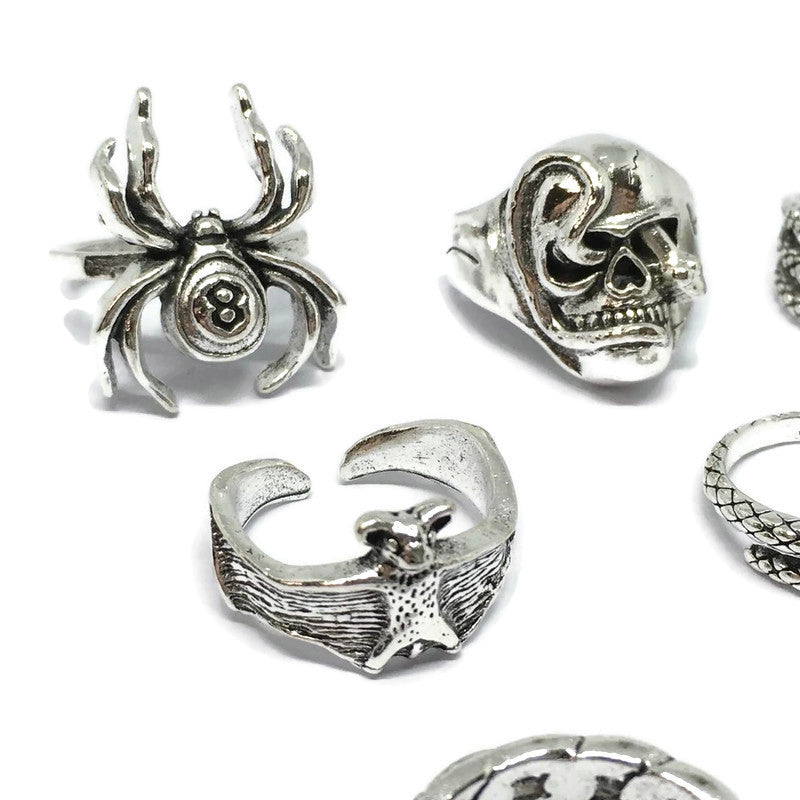 A stylish 7 Piece Spider Ring Set made of sterling silver plated steel alloy, featuring intricate spider designs.